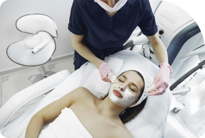 Esthetician performing a facial services at Facials & Skincare by Debbie in Orange, CA