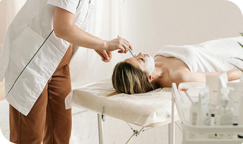 Esthetician applying a chemical peel treatment at Facials & Skincare by Debbie, Orange County, CA