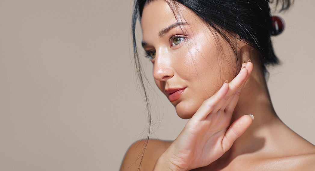 Woman with smooth, glowing skin after professional facial treatment in Orange, CA