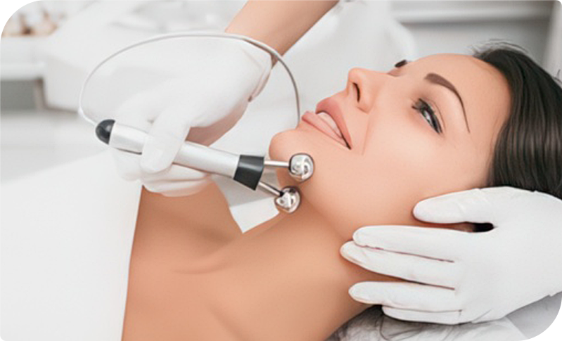 Woman receiving a Microcurrent Facial Treatment to lift, tone, and rejuvenate skin at Facials & Skincare by Debbie in Orange, CA.