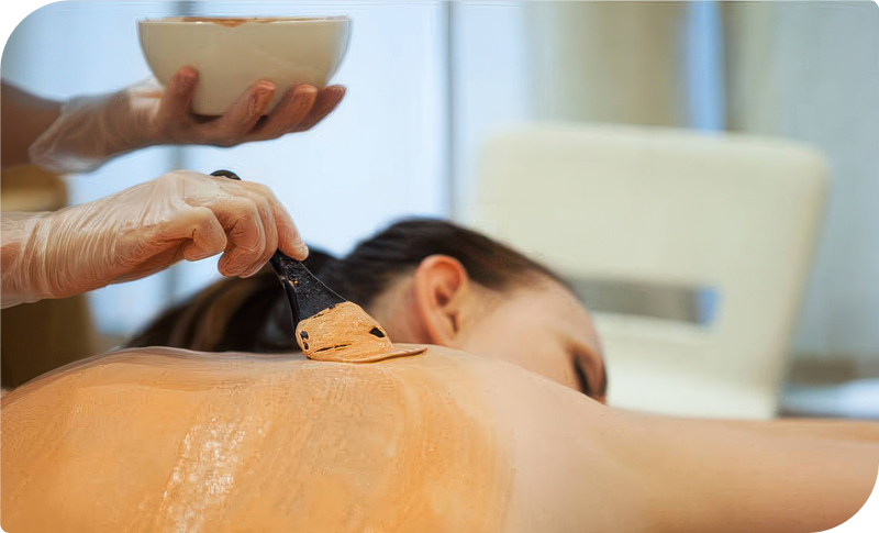 Woman receiving a Beautifying Back Facial at Facials & Skincare by Debbie, Orange, CA